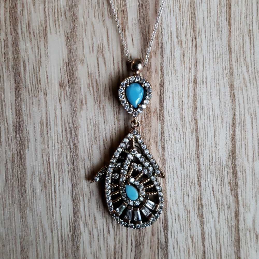 Shell shaped pendant with sterling silver …